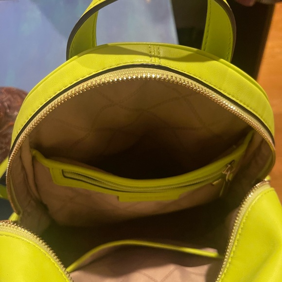 Gently used in excellent condition Michael Kors neon green back pack purse. - Picture 4 of 8